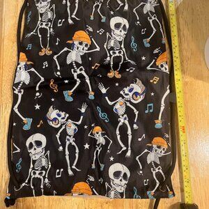 black drawstring backpack‎ vibrant all-over print of dancing skeletons & notes